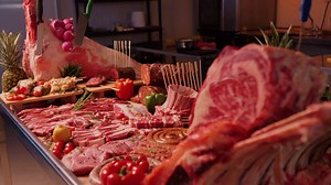 Decorative layout of meat goods on display in a butchers kitchen.