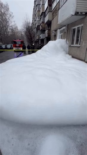 Anatolii Marynyuk on Instagram: "A washing machine failure triggers an incredible buildup of foam. It overflows uncontrollably, pouring out through the balcony, seeping from the doorway, and filling the stairwell of a high-rise building. The foam continues to spread across common areas, creating a chaotic scene. Police and firefighters arrive to manage the situation, but the overflow keeps getting worse. This text and video are entirely fictional and created using artificial intelligence."