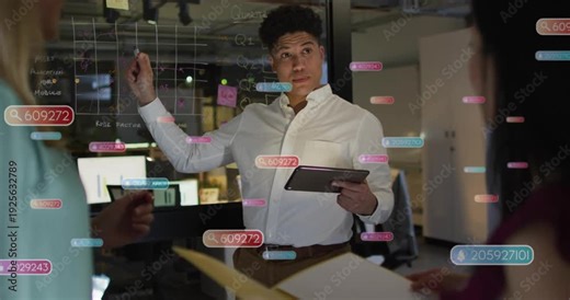 Presenter consulting tablet, pointing at glass grid and generating data overlays for business plan