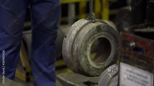 Engineer moves aluminium extrusion die with a crane beam. Modern Aluminium extrusion production line factory die collection. Production of Complex lightweight extruded aluminium metal profiles