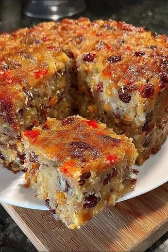 🎄 Never-Fail Fruit Cake: The Moist, Irresistible Recipe That Converts Fruit Cake Skeptics! 🍊 This isn’t your grandma’s dry fruit cake — this one tastes like Christmas candy in cake form! Let’s be honest, most of us have avoided fruit cake at least once. Those dense, dry loaves with neon-colored fruit just didn’t do it for me either. But this version? It completely changed my mind. The secret is simple: sweetened condensed milk. It gives the cake incredible moisture and richness, making it soft