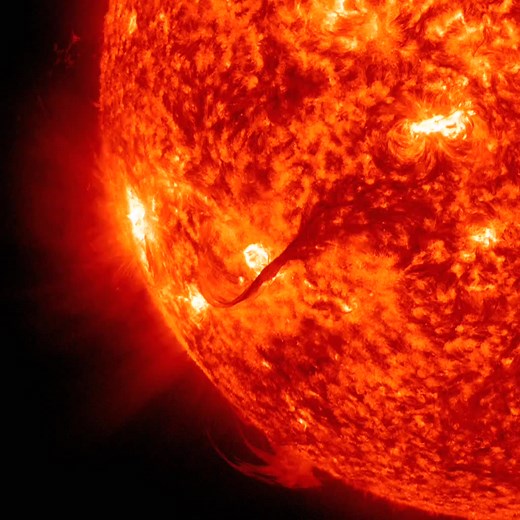 Magnificent Outburst • Sparked by a medium-sized (C-class) flare, a long, magnetic filament burst out from the Sun, producing one of the best shows that SDO has seen (Aug. 31, 2012). Viewed in the 304 Angstrom wavelength of extreme ultraviolet light, the filament strand gets stretched outwards until it finally breaks and heads off to the left. Some of the particles from this eruption did hit Earth with a glancing blow on Sept. 3, generating some beautiful aurora. The video clip covers four hours