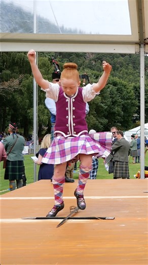 One of the youngest competitors in the Scottish Sword dance heats, held during the 2024 Ballater Highland Games in Deeside, Scotland, when they celebrated their 160th anniversary Games. You will see this is a dance where they watch their feet placement carefully. The piper here is Richard Anderson, a great piper who has played for some of the biggest events, and best known names, in the Highland dancing world. #ballaterhighlandgames #sworddance #highlanddancing | Scotland Online