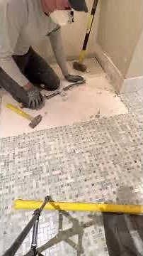 Fastest way to remove mosaic tile flooring with basic hand tools.