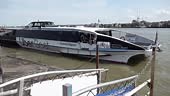People watch as the Thames Clipper boat arrives at Port Tilbury with...