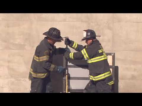 Forcing Entry on a Metal Door Using an Ax and a Halligan