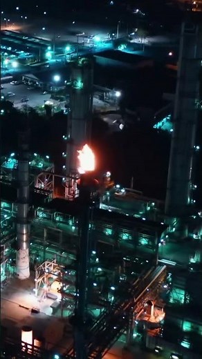Flare at a Refinery at Night - Drone Aerial Footage