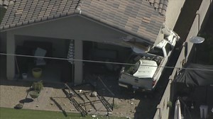 Truck crashes into Phoenix home, possibly causing structure damage
