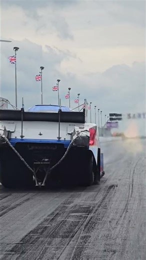 Would you lean in to a funny car whilst in full stage? 🫣 #dragracing #santapod #funnycar