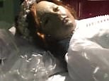 Is this the creepy moment the corpse of a girl OPENS her eyes?
