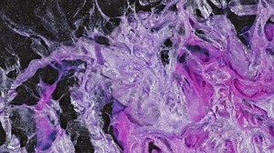Purple ink flowing, creating an abstract pattern with purple veins and swirling ink. The fluid pattern from liquid pink and silver threads on a dark glitter background.