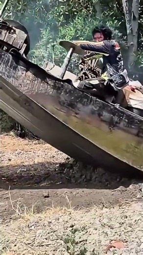 Fishermen Launch Boats from Steep Shorelines