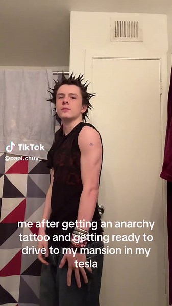Getting Ready to Drive My Tesla with Anarchy Tattoo