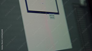 Freelancer, remote graphic designer draws on a computer prototype of a website, layout, app icon design for a smartphone, UI UX design. NFT product for sale on the exchange