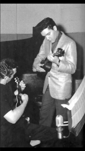 Elvis Presley with Ukulele player Bernie Lewis at BLUE HAWAII recording session. March 1961.