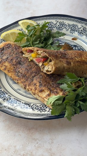 Balik Ekmek, a classic Turkish street food, features fresh, deboned fish grilled to perfection and served with fresh fixings. This popular waterfront sandwich from Istanbul combines crispy white fish fillets, tangy pomegranate molasses sauce, fresh vegetables, and lavash bread. Discover how to recreate this iconic sandwich at home with my easy recipe. Recipe link https://www.unicornsinthekitchen.com/balik-ekmek-turkish-fish-sandwich/ | Unicorns in the Kitchen