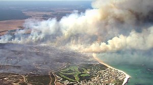 Ledge Point bushfire north of Perth downgraded after emergency