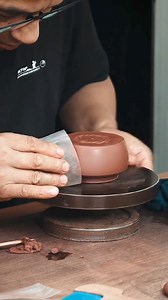 🌟 The Tradition of Yixing Zisha Teapots 🌟 Have you ever wondered what makes Yixing Zisha teapots so unique? Step into the world of age-old craftsmanship where tradition meets art. 🌿✨ Every Yixing Zisha teapot begins as a block of clay, skillfully shaped by artisans who have passed down their expertise through generations. Picture the process—the attention to detail, the precision of every stroke, and the passion that goes into each teapot. These teapots are more than just tools; they are a li