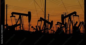 A nodding donkey pumps crude oil up from the ground well on an oil field