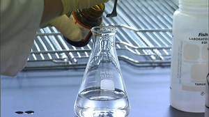 Download Lab worker mixes vile for free