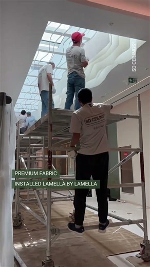 Wave Fabric Ceiling installed under a glass skylight