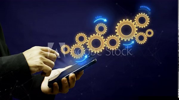 Business process and workflow automation with flowchart. Business and technology concept. Businessman shows animated spinning gear icons arranging processing management on virtual screen.