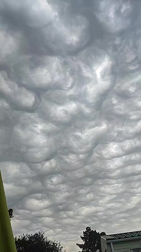 Dramatic Sky: Dark Swirling Clouds and Impending Storm