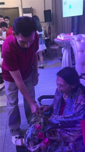 Carlos gives a Rose the Emma for her 90th Birthday