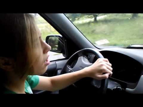 Little girl learning how to drive teaching daughter driving lessons