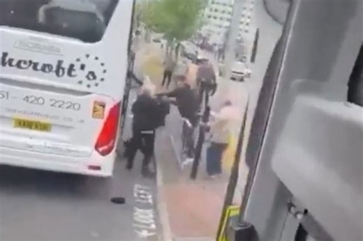 Man Utd and Liverpool fans fight in street as man kicked in head in sickening coach video
