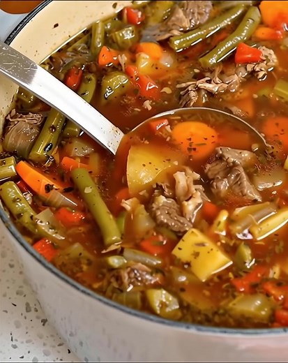 “Beef Vegetable Soup is made with tender chunks of slowly simmered chuck roast with onions, celery, carrots, potatoes, tomatoes, and green beans. I love to serve this tasty soup with crusty baguettes or cornbread with soft sweet cream butter. This Vegetable Beef Soup is a wholesome, hearty fall and winter meal that you can feel good about serving your family.” Full recipe 👇 💬 | Old fashioned recipe