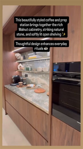 Style Kitchens on Instagram: "Luxury Design ✨ This German Hacker Kitchen, in Walnut with bronze handle less channel profile detail has been designed for modern living. Crafted cabinetry alongside statement natural stone ✨ The beautifully styled coffee and prep station brings together the rich walnut cabinetry, striking natural stone and softly lit open shelving. Thoughtful design enhancing everyday rituals ☕️ #kitchendesign #kitcheninspiration #kitchen #kitcheninspo #homedesign"