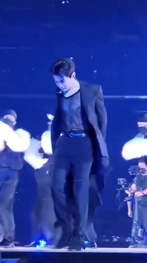 Energetic Dance Performance in Dramatic Stage Setting