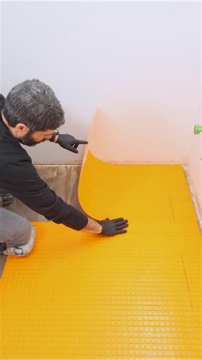 Home Repair Tutor on Instagram: "DITRA Peel and Stick installation tips…I prime the plywood with PRIMER-PS. Then I cut all mats to size. I pull the plastic off and bond the mat to the floor and against adjacent sheets. The most important step is to activate the pressure-sensitive adhesive with a float. Many thanks to Schluter for sponsoring this video and continuing to make great products for tile floors 👍🏽🔥#ditra #schlutersystems #bathroomremodel #tilefloor #sponsored"