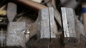 Bench vise tool is equipment for hold details in industry. Male bench vise opens and then clamps.