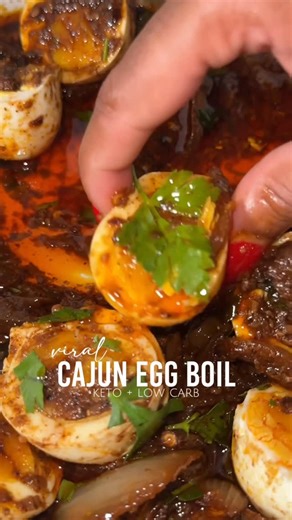 Ebony Cierra | Keto + Low Carb on Instagram: "✨ VIRAL CAJUN BOILED EGGS ✨ Hands down my fav thing to eat 😭🙌🏽 ***I boiled my eggs for 7.5 minutes, but if you like them boiled harder, boil them for a little longer! These eggs are a game changer! They’re packed with protein and healthy fats, and they help curb cravings to keep you full! I’ve seen sooo many people post about these helping them on their weight loss journey! #cajunboiledeggs #eggboil #cajuneggs #cajunboil #boiledeggs #ketosnacks #l