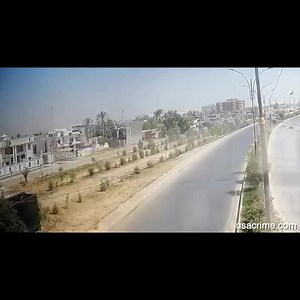 Aftermath of suicide bombing of a motorcycler in Iraq