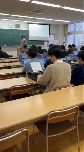 There's a student using a typewriter in a computer class! #sora