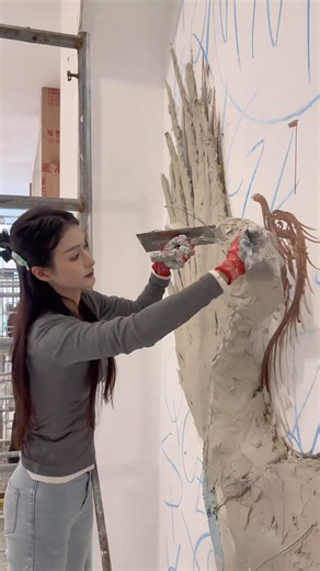 A girl making a relief mural #skills #cool #art #artist