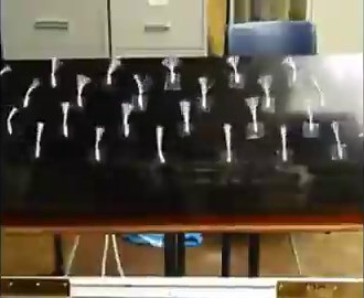 Tuft visualization in a Delft vertical wind tunnel: each strand shows local airflow. With plasma OFF, tufts flutter, separation. That orange line is a DBD plasma actuator; turn it ON and tufts snap aligned as it adds momentum to the boundary layer, keeping flow attached.