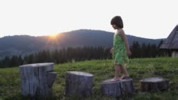 Little Girl Climbs On The Stumps - HD stock video