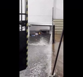 Bus and cars stranded amid heavy flooding in Seville, Spain