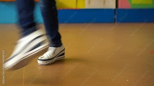 Female feet dancing breakdance on the dance floor, Close-up shot of dancing feet in white sneakers Stock Video