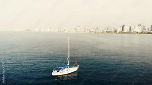Drone flying above a yacht 4k
