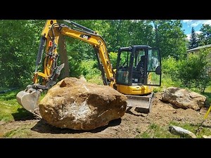 Caterpillar 305.5e2 Moving Large Boulder