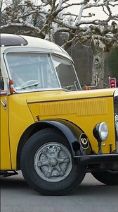 Zurich city classic yellow Swiss Post bus leaving with horn sound.