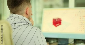 Male architect designing buildings using computer programs. Construction professional 3D model project development concept shown on screen