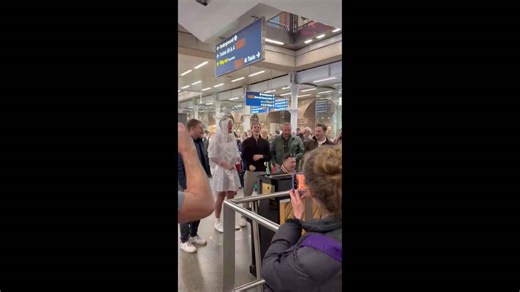 Premier League star Joe Worrall sings in wedding dress at London station