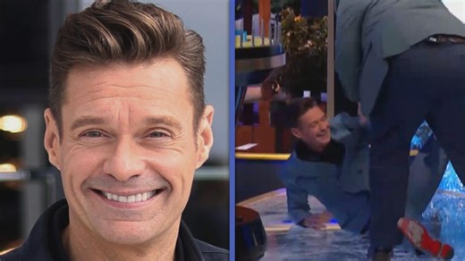 Ryan Seacrest takes a tumble on the set of 'Wheel of Fortune' while celebrating with the show’s latest winner, Daniel Thomas. | Entertainment Tonight
