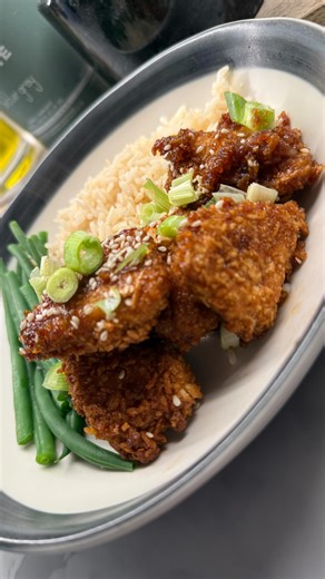 YUM! 🤩 ✨ Crispy, sticky, Sesame Chicken - this is so packed with flavour! Originally spotted on @boredoflunch (thanks for the inspo 👏). I skip the sriracha from the original recipe, but if you like heat, add 3 tbsp to the sauce! Leftovers are perfect sliced into a wrap with a bit of salad the next day 👌 For the sauce: 1 tsp sesame oil 2 tbsp soy sauce 3 tbsp honey 2 tbsp sweet chilli sauce 1 tsp rice wine ½ tsp Chinese 5 Spice #chicken #chickennuggets #tasty #chinesefood #chinesefoodlover #ai